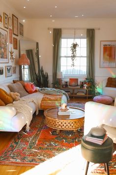 a living room filled with furniture and lots of windows