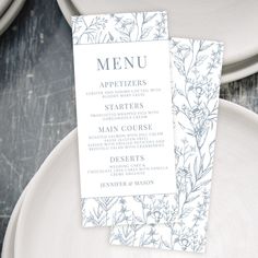 a menu card sitting on top of a white plate