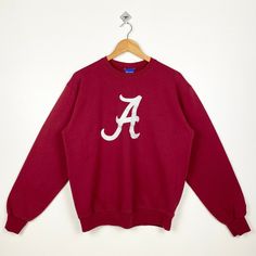 Vintage NCAA University of Alabama Crimson Tide Crewneck Sweatshirt Patch Logo Red Color Men's M - Made in Honduras  - Materials : Cotton, Polyester - Tag Reads : M Kindly see the actual measurements (All measurements were taken lying flat) - Actual size manual measurements * Width (Armpit to armpit) : 22.5 inches * Length (Shoulder to end of garment) : 25.5 inches * Sleeve length : 25 inches - Condition : * Good condition 8/10 (80%) * Minor stain refer picture  * Free from hole and major defect SHIPPING: * DHL EXPRESS = 3-6 business day arrived * Please PROVIDE your PHONE/CONTACT NUMBER for SHIPPING/DELIVERY purpose * DONT FORGET TO VISIT MY STORE FOR MORE GREAT STUFF, THANK YOU. Alabama Sweatshirt, Vintage University, University Of Alabama, Gameday Outfit, Alabama Crimson, Gaming Clothes, Alabama Crimson Tide, Crimson Tide, Printed Sweatshirts