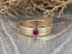 Mens Ruby Wedding Band, Princess Cut Ruby Mens Wedding Band, Solid Gold 10k/14k/18k Wedding Ring, His Wedding Band by Sapheena A classic men's wedding band that set with a single brilliant princess cut Red Ruby made in solid 14k/18k yellow gold. Also available in rose, white or yellow gold. You can choose your finish to be shiny or matte. ** Ring Description: * Metal: solid 14k/18k rose, white or yellow gold * Princess cut red ruby * Total carat weight approx. 0.18ct * Ring width: front approx. Ruby Mens Wedding Band, His Wedding Band, Ruby Wedding Band, 14k Rose Gold Wedding Ring, Ruby Bands, Princess Cut Gold, Ruby Wedding, Precious Jewelry, Mens Wedding Rings