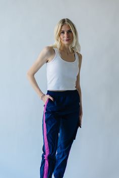 We couldn’t keep something this good to ourselves. These jogger style windbreaker pants our exclusive to us + come in inclusive sizing. They have a thick + flexible waistband with pink stripe down the sides of the legs. Pair with The Dua Windbreaker to make it a set. Details Model is wearing a small self/lining: 100% cotton Fabric Care Guide Here Sizing & Fit Measurements are approximate and taken while laying flat across the front. Not doubled. x-small: waist = 12"; length = 38"; inseam = 27" s Style Windbreaker, Piper And Scoot, Windbreaker Pants, Fashion Joggers, Small Waist, Pink Stripes, Fabric Care, Cotton Fabric, Navy