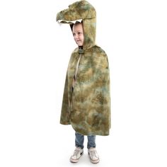 a little boy wearing a dinosaur costume standing in front of a white background with his mouth open