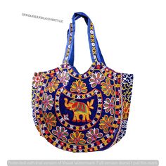 Eco-Friendly hand bag is made of a cotton with fine rajasthani embroidery with mirror work design on it that makes it durable enough to tote around all your things - **High-Quality Material Made of durable cotton with fine Rajasthani embroidery and mirror work, ensuring long-lasting use. - **Unique Design Features intricate embroidery on both sides, showcasing traditional Rajasthani craftsmanship. - **Generous Size With a length of 37 cm and a width of 50 cm, it provides ample space for all your essentials. - **Secure Closure Equipped with a zipper closure to keep your belongings safe and secure. - **Double Straps Designed with double straps for comfortable carrying. - **Interior Pocket Includes a small interior pocket, perfect for storing loose items like keys, coins, or a phone. - **Mult Multicolor Shoulder Bag With Dori Work For Festivals, Traditional Blue Shoulder Bag For Festivals, Festival Rectangular Dori Work Shoulder Bag, Bohemian Multicolor Bags With Zari Work, Blue Embroidered Bag For Festivals, Traditional Bags With Mirror Work For Festivals, Bohemian Multicolor Zari Work Bag, Traditional Blue Bags For Festivals, Traditional Blue Embroidered Shoulder Bag