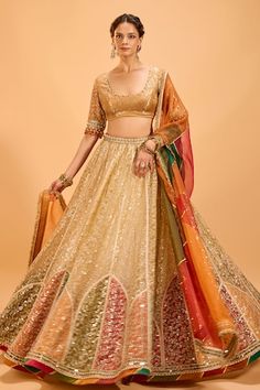 Gold and multicolor attached cancan lehenga with multicolored accents. Paired with a padded banarasi brocade blouse with pearl and sequin embroidery and tasseled sleeves and colorblocked embroidered border dupatta. - Aza Fashions Multicolor Tissue Silk Choli For Wedding, Multicolor Tissue Silk Sharara For Reception, Multicolor Tissue Silk Choli With Dupatta, Multicolor Tissue Silk Choli For Reception, Multicolor Tissue Silk Lehenga For Parties, Designer Multicolor Tissue Silk Lehenga, Festive Multicolor Tissue Silk Lehenga, Multicolor Tissue Silk Lehenga With Sheer Dupatta, Cape Lehenga