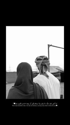 two people standing next to each other wearing headscarves