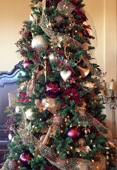 a christmas tree decorated with red and gold ornaments