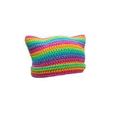 a multicolored crocheted pillow on a white background