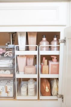 the inside of a bathroom cabinet filled with personal care items