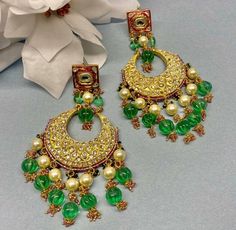 Indian Jewelry are always a part of all the Indian celebration around the globe . One definitely complete her look once they own it . This Chandbali kundan  earrings are plated in gold plating for longer lasting. This Chandbali Earrings looks beautiful  and elegant perfect for all occasion on any outfits you choose to wear (saree, salwar suits, lenga, etc.) *High quality craftsmanship 100% satisfaction guarantee  *Plated in  Gold plating *Earring Closure push back *base metal for earring is brss * Earring length 11cm *package include Chandbali earrings  *ready to ship from Houston TX United States GIFT- It comes in gift box perfect for gifting to your mom , sister, in laws, friends, on there birthday, wedding , bridal shower, anniversary, festival , and many more... Discover a variety of N Traditional Green Round Pearl Earrings, Traditional Chandbali Bridal Earrings For Anniversary, Green Chandbali Pearl Earrings For Celebration, Traditional Chandbali Chandelier Earrings For Anniversary, Traditional Green Earrings For Wedding, Traditional Green Wedding Earrings, Traditional Handmade Bridal Earrings For Anniversary, Traditional Pearl Earrings For Anniversary, Handmade Traditional Bridal Earrings For Anniversary