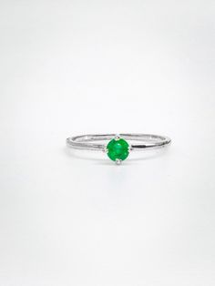 An Emerald Ring crafted from 925 silver is a stunning piece of jewelry that combines the elegance of the precious gemstone with the affordability and durability of sterling silver. Emerald, the birthstone for May, is renowned not only for its breathtaking green hue but also for its metaphysical and healing properties. This gemstone is believed to possess various attributes, including promoting love, compassion, and harmony within relationships. It is also associated with enhancing mental clarity, creativity, and intuition, making it a popular choice for those seeking personal growth and self-improvement. In the realm of physical healing, emeralds are thought to support the heart, liver, and immune system, contributing to overall well-being. Wearing an Emerald Ring can symbolize rebirth and May Birthstone Emerald Solitaire Open Ring, Emerald Solitaire Ring For May Birthstone, Fine Jewelry Emerald Ring In Sterling Silver, Sterling Silver Open Emerald Ring As Birthstone, Green Emerald Solitaire Stackable Rings, Green Emerald Open Ring Stackable Rings, Green Emerald Stackable Rings With Round Band, Green Emerald Stackable Rings With Prong Setting, Green Emerald Stackable Open Rings