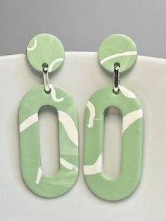 Beautiful lightweight Polymer clay earrings, in a pale mint green and white pattern. Oval loops with a stud post. Handmade, so each earring is unique, and one of a kind. The earrings have a stud post which is nickel free. Handmade with love in Ireland 🇮🇪 Everyday Green Hand Painted Earrings, Everyday Hand Painted Green Earrings, Minimalist Green Polymer Clay Earrings, Trendy Green Hand-painted Earrings, Trendy Green Hand Painted Earrings, Trendy Hand Painted Green Earrings, Green Polymer Clay Earrings, Pale Mint Green, Baby Burp Cloths