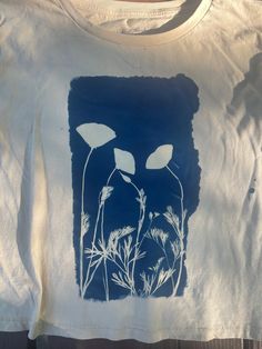 a t - shirt with an image of flowers on it