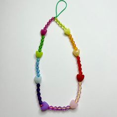 Handmade Multicolor Phone strap. 🧡 Materials: Crystals beads, Plastic Beads. 💕 9 inches long Adjustable Multicolor Beaded Necklace With Heart Beads, Bohemian Rainbow Heart Beads, Rainbow Heart Shaped Beads, Rainbow Heart-shaped Beads, Rainbow Beaded Necklace With Heart Beads, Rainbow Heart Beads Necklace, Multicolor Heart-shaped Beaded Necklace, Crystals Beads, Phone Strap