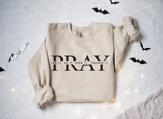 Religious Sweatshirt, Pray On It, Pray Over It, Pray Through It Shirt, Pray Sweatshirt, Faith Shirt, Jesus Sweater, Womens Christian Shirts Sizing and Color Information: Our shirts are made to order specially for you. For this reason, we don't accept returns or exchanges. To ensure the perfect fit, please refer to our color and size charts before placing your order. If you have any questions, don't hesitate to send us a message to clarify sizing or colors. HOW TO ORDER MULTIPLES: 1. Select your size and color in the drop down menus & add to cart! 2. Then simply go back and repeat for each shirt. If you want to add or change anything on the existing design that we show in the display picture, please contact with us. Product Information: (T-shirts and Long Sleeve T-shirts) Solid colors such Pray Sweatshirt, Jesus Sweater, Pray Through It, Womens Christian Shirts, Pray On It, Faith Shirt, Sweater Womens, Christian Shirts, Over It