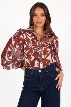 DETAILS    Make a lasting impression with this stunning blouse! This soft sheer top features a collared V neckline and long sleeves with button cuff closure. A functional row of buttons down the front ensures an effortlessly chic look.   soft sheer blouse  v neckline  long sleeves with button close  functional buttons down front  tropical print  relaxed fit  unlined   material - 100% polyester     SIZING     model is 5' 6" and wears a Size XS    model stats: bust - 31", waist - 23", hips - 34" Elegant Button-up Tops With Sheer Sleeves, Spring Button-up Blouse With Sheer Sleeves, Chic Sheer Button-up Tops, Sheer Button-up Chic Blouse, Chic Sheer Button-up Blouse, Sheer Long Sleeve Shirt For Fall, Sheer Long Sleeve Top For Day Out, Chic Collared Blouse For Day Out, Button-up Blouse With Blouson Sleeves