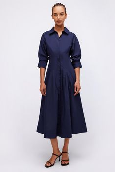 The Jazz Dress in Midnight. Sharp, shirting inspired designs accentuate a pintucked waist, cuffed sleeves and a classic midi length hemline.