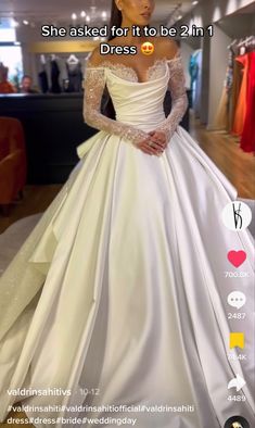 a woman wearing a white wedding dress in a store