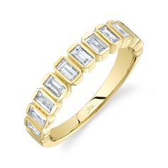 Modern in design, she will love the look of this fashion ring from Shy Creation. Crafted in 14k yellow gold, this ring features a stunning row of bezel set baguette diamonds. The diamonds are 3/4ctw, H or better in color, and SI2 in clarity. This ring measures 4.3mm in width. This ring is a size 7. Bezel Band, Baguette Diamond Band, Gemstone Diamond Ring, Bezel Set Ring, Diamond Fashion Rings, Studded Necklace, Baguette Cut Diamond, Men Diamond Ring, Bezel Diamond