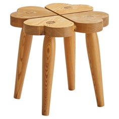 three wooden stools stacked on top of each other in the shape of four circles