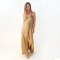 This dress is made of 100% silk charmeuse fabric. It is heavy weight, and not see-through. It is cut on the bias, which allows for its natural give and flow. Although lightweight, this garment has a lush look about it. And there is (almost) nothing as sensuous as silk against the skin!  Size S/M its dress sizes 4-10 Total Length of body without the straps (straps are adjustable) - 57 inches SHOP OUR NEW DESIGNS AT VACANCESCOLLECTION.COM Floor-length Bias Cut Silk Dress, Floor-length Silk Dress With Satin Lining, Floor-length Satin Evening Dress, Silk Lined Bias Cut Dress For Wedding, Floor-length Modal Satin Slip Dress, Bias Cut Satin Maxi Length Gown, Satin Slip Evening Dress, Floor-length, Satin Floor-length Evening Slip Dress, Floor-length Satin Slip Dress In Bias Cut