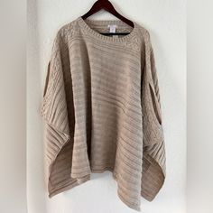 Layer Up With This Classic Pullover Poncho, Rendered In A Cable-Knit Texture With Draped Sleeves To Ensure A Cozy Fit. Oversized Casual Beige Poncho, Casual Oversized Beige Poncho, Beige One Size Batwing Sleeve Tops, One Size Beige Batwing Sleeve Top, Sweater Cape, White Poncho, Knit Poncho Sweater, Charcoal Sweater, Cowl Neck Poncho