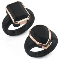 two black and gold rings with the word ring it on each side, one has an oval