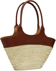 Woven straw tote in beige. · Buffed leather trim throughout · Twin carry handles · Logo stamp at face · Open throat · Unlined · H10.5 x W20 x D3.5 Supplier color: Noisette Designer Straw Basket Bag With Braided Handles, Designer Brown Woven Leather Straw Bag, Designer Brown Leather Woven Straw Bag, Designer Brown Straw Bag With Woven Leather, Designer Straw Tote Bag With Bamboo Handle, Designer Brown Straw Shopping Bag, Designer Natural Straw Bag With Bamboo Handle, Designer Brown Straw Bag For Shopping, Designer Natural Straw Bag With Handles