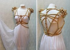 the back of a white dress with gold chains on it and an image of a mannequin's torso