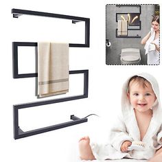 a baby sitting on the floor in front of a towel rack with two towels hanging from it