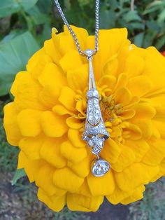 "A beautiful Edwardian platinum necklace with old mine cut diamonds. The largest diamond is approximately .36ct. A total of 16 smaller diamonds complete the beautiful bell shaped pendant. The platinum pendant measures 1-1/2\" long and hangs from a platinum chain. The full length of the necklace is 16\" and has a 14k white gold clasp. I plan to switch to a platinum clasp prior to shipping the item. The necklace weighs 5.8 grams. This piece is would be lovely for a wedding or special occasion." Mikimoto Pearl Earrings, Platinum Necklace, Platinum Pendant, Platinum Chain, Yellow Pearl, Cameo Earrings, Rock Jewelry, Jade Earrings, Wedding Anniversary Gift