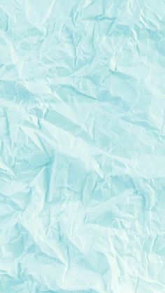 an abstract blue background with wrinkled paper