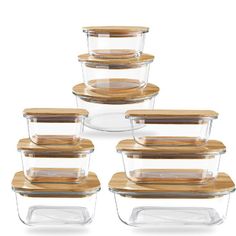 glass containers with wooden lids are stacked on top of each other in order to keep food fresh