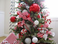 a christmas tree decorated with red and white ornaments