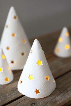 white paper christmas trees with gold stars on them and the words, strunning holiday diy's