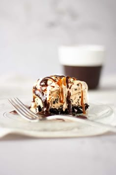 a piece of ice cream cake on a plate with a fork