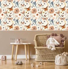 an image of a room with flowers on the wall and a teddy bear sitting in a chair