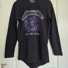 Nwot Men's Licensed Black Metallica Ride The Lightning Terry Tunic T-Shirt Size S Never Worn. Slim Fit. Chest Measurement: Approx 18.5" Length Measurement: Front: Approx 25.75" Back: Approx 28.5" 60% Cotton, 40% Polyester Machine Washable Fall Crew Neck Top With Graphic Design, Band Merch Long Sleeve Tops With Graphic Print, Alternative Crew Neck Tops With Front Print, Edgy Streetwear Crew Neck Tops, Edgy Streetwear Tops With Crew Neck, Black Crew Neck Top With Back Print, Edgy Crew Neck Top For Streetwear, Alternative Style Crew Neck Top With Front Print, Black Long Sleeve Top With Back Print