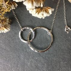 The sterling silver infinity circles necklace is a modern, classic necklace, for a special occasion or everyday wear. It has a hammered, high shine finish that reflects the light beautifully. The handmade eternity necklace makes a special mother-daughter necklace, representing the ever lasting bond. This necklace comes with an optional personalised box insert. Please write your message in the personalisation box before checkout. For no insert just leave blank, or write none. The messages picture Love Spell Candle, Mothers Day Necklace, Eternity Necklace, Mother Daughter Necklace, Personalized Jewelry Box, Christmas Necklace, Daughter Necklace, Classic Necklace, Rose Quartz Stone