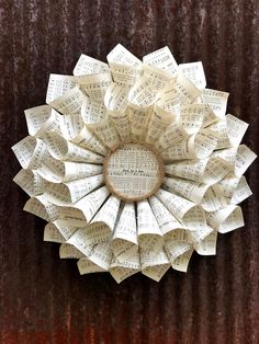 a paper flower made out of sheet music