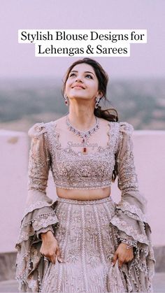 a woman standing on top of a roof wearing a dress