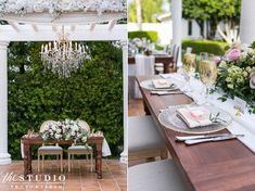 the table is set with flowers and place settings for an outdoor dinner party or reception