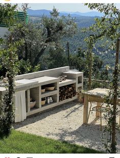 an outdoor kitchen is built into the side of a hill