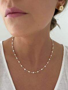 D E T A I L S - 18K Gold Filled, Freshwater Pearls Synthetic - 16" length with a 2" extender - Lobster Clasp  M A T E R I A L S At Dylan Rae, we are committed to handcrafting jewelry that is perfect for everyday wear. Our high-quality gold filled designs contain 100+ times more real gold than gold plated components. The thick outer layer of gold makes it highly durable and safe for people with allergies or sensitive skin. C A R E Care for Your Gold Filled Jewelry: Wear It, Love It, Care for It! Our gold-filled pieces are crafted to be your lifelong companions. Feel free to wear them every day, even while showering, but remember to avoid exposing them to saltwater and chlorine. These elements can diminish their luster over time and may even cause oxidation if they come in contact with your Affordable 8mm Bead Pearl Necklace, Dainty Pearl Necklace, Diy Jewelry Necklace, Jewelry Dainty, Freshwater Pearl Necklace, Necklace Minimalist, Shell Jewelry, Freshwater Pearl Necklaces, Gold Filled Jewelry