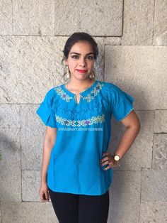 Chiapas hand embroidered turquoise mexican blouse, summer solstice boho shirt, cinco de mayo top, rombo motif embroidery, zinacatan top, mex Pretty Mexican top. Hand-embroidered. Made of very soft muslin and comfortable. Fits Size Medium Care instructions: Wash by hand with cold water and hang to dry. * Visit the shop * https://www.etsy.com/shop/Miamorcitocorazon * Follow us on instagram * @miamorcitocorazonmx ------------------------------------------------------ I don't accept returns, exchang Mexican Top, Motif Embroidery, Mexican Blouse, Blouse Summer, Boho Shirt, Mexican Party, 1st Birthday Outfits, Boho Shirts, Summer Solstice