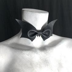 "captivating bow tie suitable for an unorthodox funeral. ~ bat made from faux vegan leather ~ ghoulish update on classic bowtie style ~ perfect for a gothic evening out ~ your choice: with or without fangs ~ choker band measures 1/2\"{1.27cm} wide ~ bat measures 6\" {15.24cm} wide x 3\" {7.62cm} high ~ adjustable to help find the perfect fit ~ closes in back with black metal hook ~ measure your neck circumference {9th pic} ~ choose your size from the drop down menu ~ if you are in-between measur Bat Choker, Goth Choker Necklaces, Bat Bow, Goth Choker, Vampire Fangs, Gothic Chokers, San Angelo, Halloween Vampire, Black Goth