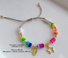 the bracelet is decorated with different colored beads and gold charms, including a star charm