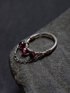 a close up of a ring on a rock