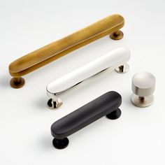 three different types of handles and knobs on a white surface