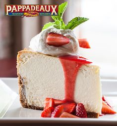 a piece of cheesecake with strawberries and whipped cream