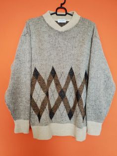 "Gorgeous Designer Sweater by Louis Féraud. It's an original vintage alpaca wool sweater made in Italy. Fabulous Blouse! Condition: In very good used condition. Material: 50% Wool, 35% Alpaca, 15% Acrylic Size label: L *Please check the measurements below to make sure they fit correctly! Measurements: Pit to pit: 58 cm/22.83\" Length : 65 cm /25.59\" Sleeve Length:55 cm /21.65\" Shoulders: 50 cm/19.68\" ✈Shipping: All items will be shipped via priority mail with tracking number. If you have ques Vintage Grandpa Sweater, Multicolor Retro V-neck Sweater, Vintage Novelty Sweater, Alpaca Wool Sweater, Vintage Multicolor Jacquard Knit Sweater, 80s Print Sweater, Louis Feraud, Sweater Making, Sweater Design